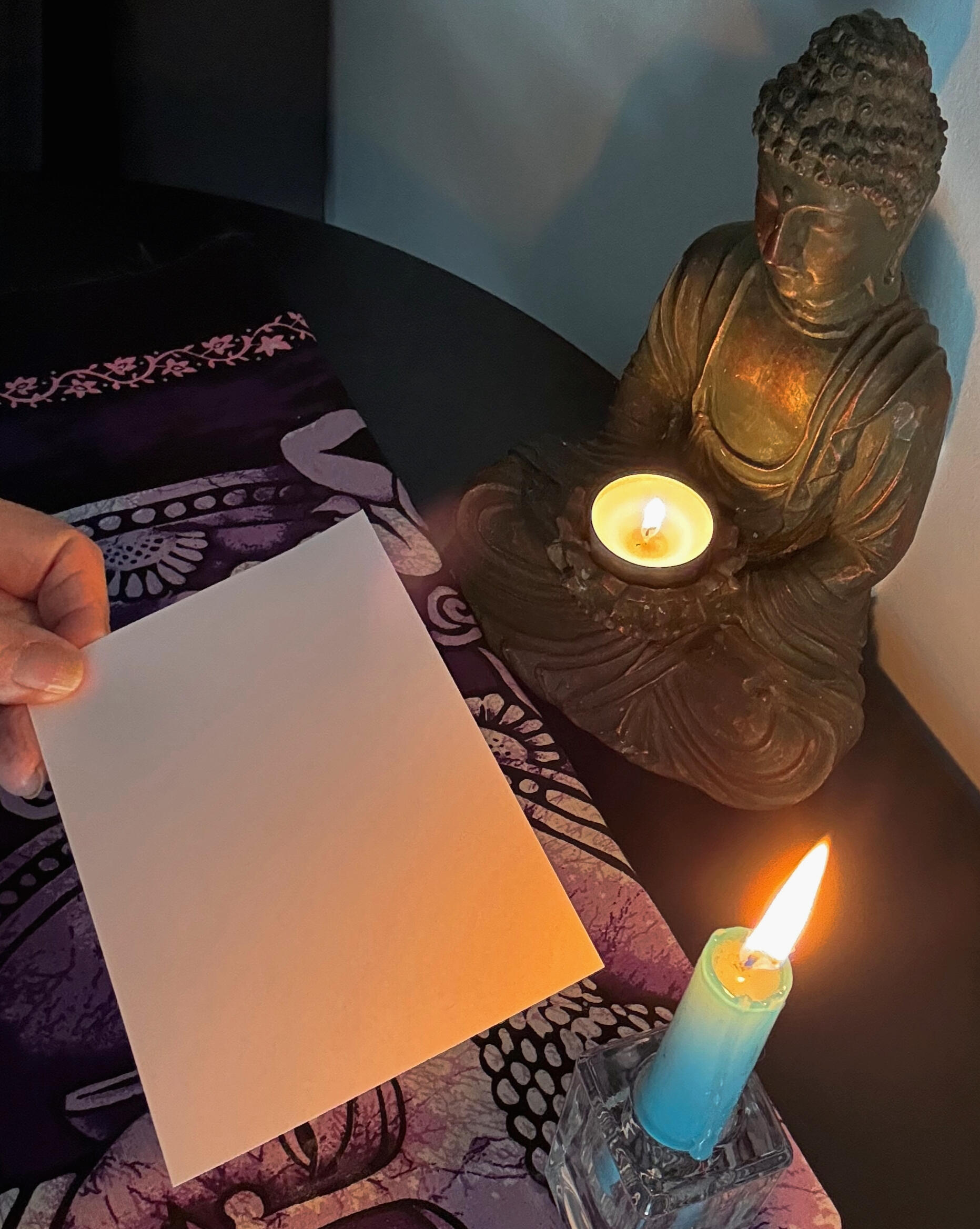 The Beginning- Creating Spirit Soot Images A blank Bristol card held near a candle flame during Diane Stackwick's soot art process.