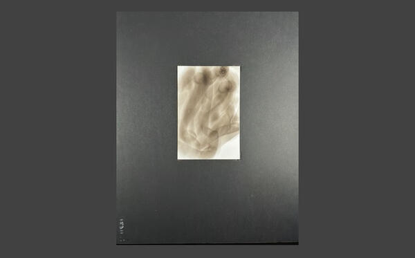 The Beginning- Creating Spirit Soot Images A blank Bristol card held near a candle flame during Diane Stackwick's soot art process.
